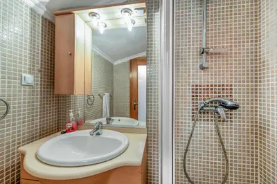 a bathroom with a sink and a shower at Sunset Villa No 19 in Galé