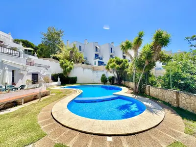 a swimming pool in the backyard of a house at Albufeira Amazing View With Pool by Homing in Albufeira