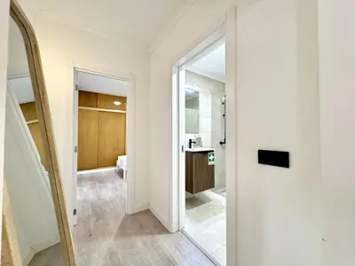 a hallway with a mirror and a bathroom at Albufeira Amazing View With Pool by Homing in Albufeira