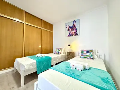 a room with two beds in a room at Albufeira Amazing View With Pool by Homing in Albufeira