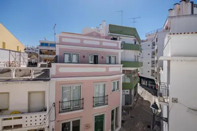 an empty street with a mosaic on the ground at Faro Downtown Suites - Vila Adentro in Faro