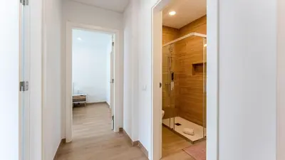 a bathroom with a walk in shower and a toilet at Elegant 2BDR Apartment in Quarteira by Lovelystay in Quarteira
