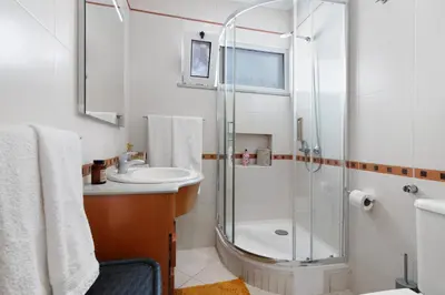 a bathroom with a shower and a sink at Casa Vista Mar in Albufeira