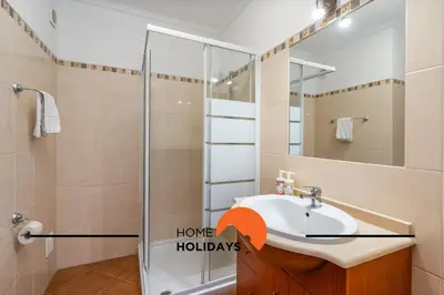 a bathroom with a sink and a shower at #286 Avenida de Ceuta - Alsol by Home Holidays in Quarteira