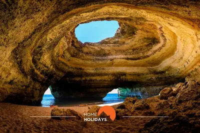 a rock cave with a hole in the water at #286 Avenida de Ceuta - Alsol by Home Holidays in Quarteira