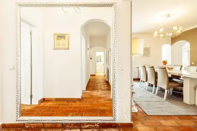 a large mirror in the hallway of a home at Lovely Very Private Villa with Beautiful Gardens in Guia