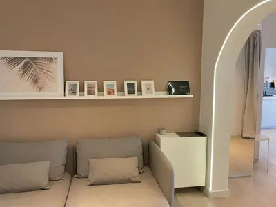 a living room with a couch and a shelf at Sunflower12 - Apartamento à beira-mar - Seaview in Quarteira
