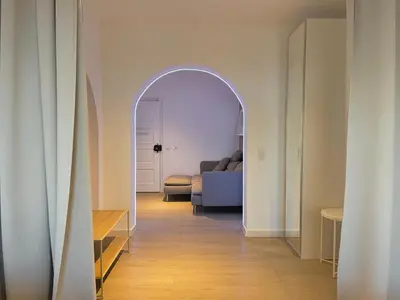 an archway leading into a living room with a couch at Sunflower12 - Apartamento à beira-mar - Seaview in Quarteira