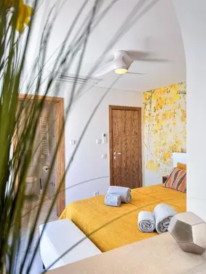 a bedroom with a bed with towels on it at Luxury Beach House - Casa do Farol by BeCherish in Albufeira