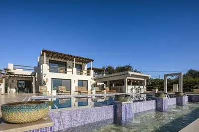 a villa with a swimming pool and a house at Villa Avalon - Bedzy Luxury in Almancil