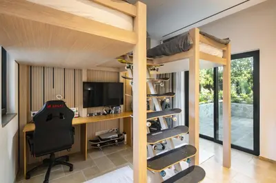 a room with bunk beds and a desk and a computer at Villa Avalon - Bedzy Luxury in Almancil