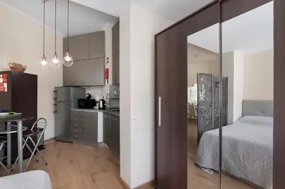 a small apartment with a bedroom and a kitchen at Faro Downtown Suites - Ria Formosa in Faro