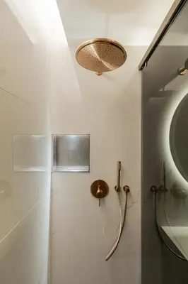a bathroom with a shower and a sink at The View at The Downtown Faro in Faro