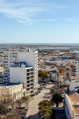 an aerial view of a city with buildings at The View at The Downtown Faro in Faro