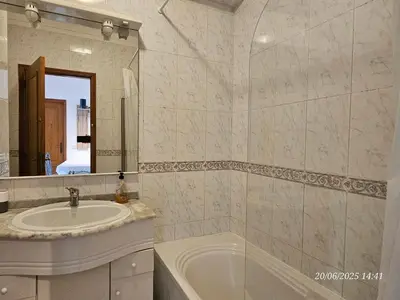 a bathroom with a sink and a tub and a mirror at Blife Candya private apartment in Monte Negro