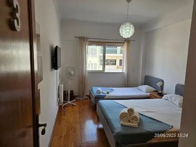 a hotel room with two beds and a window at Blife Candya private apartment in Monte Negro