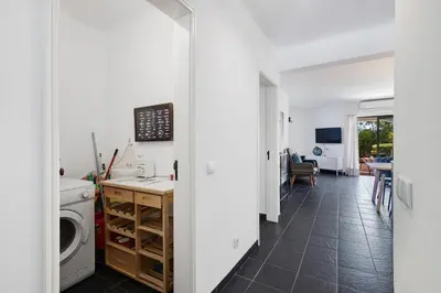 a laundry room with a washer and dryer at Kyara House in Albufeira