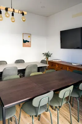 a conference room with a large table and chairs at Guest House Mercado in Faro