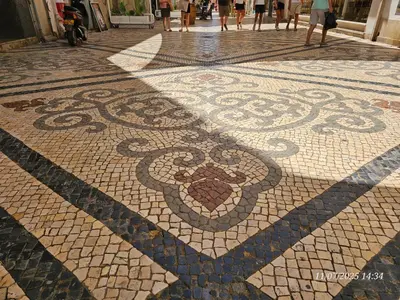 a mosaic floor with a heart on it on a street at Blife Osonya - private rooms at Santantonya 4th floor in Faro