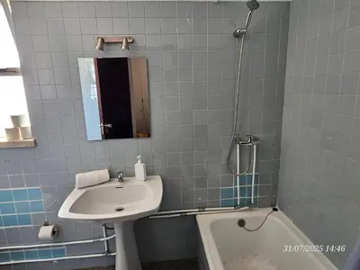 a bathroom with a sink and a bath tub at Blife Osonya - private rooms at Santantonya 4th floor in Faro