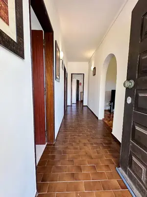 a hallway with a door and a tile floor at Vista Golf by Becherish in Bicas