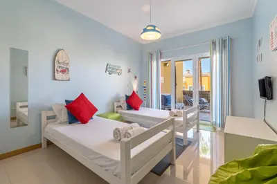 a hospital room with two beds and a tv at Vale Parra Vilage T2 in Guia