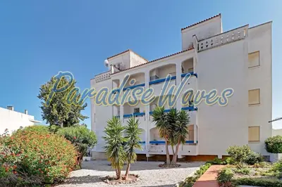 a large white building with a sign on it at Apartment Ouramar - 550 meters from de beach in Albufeira