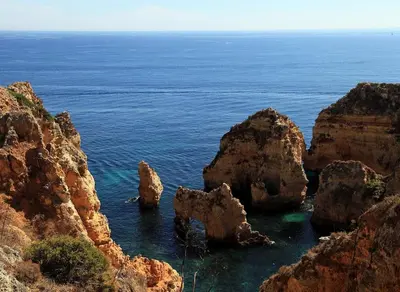a group of rocks in the water near the ocean at Apartment Ouramar - 550 meters from de beach in Albufeira