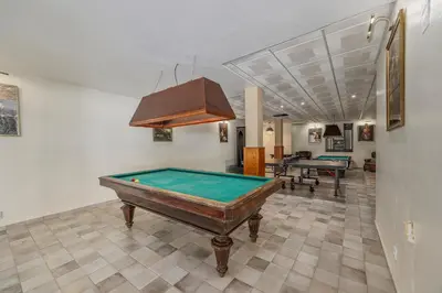 a billiard room with a pool table in it at Villa Saromani in Branqueira
