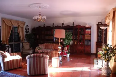 a living room with couches and bookshelves at Vila Candeias, Vilamoura, Algarve, Beach, 10p in Quarteira