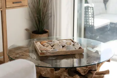 a living room with a chair and a coffee table at Apartment Belharucas in Albufeira