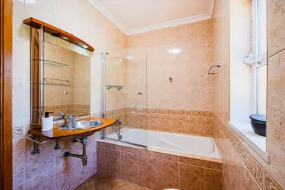 a bathroom with a tub and a sink at Villa Okapi by Atlantic Places in Albufeira