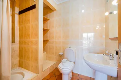 a bathroom with a sink and a toilet and a shower at Villa Okapi by Atlantic Places in Albufeira