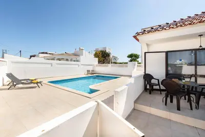 a patio with a swimming pool on a house at Villa Lela in Galé