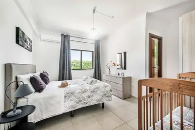 a bedroom with a bed and a window at Villa Dela in Galé
