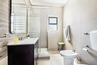 a bathroom with a toilet sink and a shower at Villa Dela in Galé