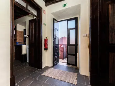 a hallway with an open door with a fire extinguisher at Akivillas Loulé Holiday in Espargal