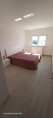 two beds in a room with two windows at Almancil Residence in Almancil