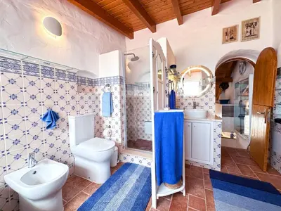 a bathroom with a toilet and a sink at Charming AlgarvianOceanfront Townhouse by BeCherish in Albufeira
