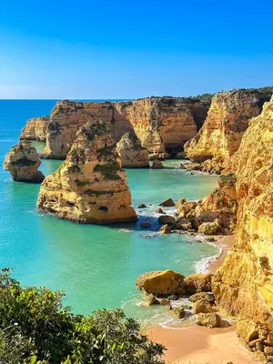 a view of a beach with rocks and the ocean at Charming AlgarvianOceanfront Townhouse by BeCherish in Albufeira