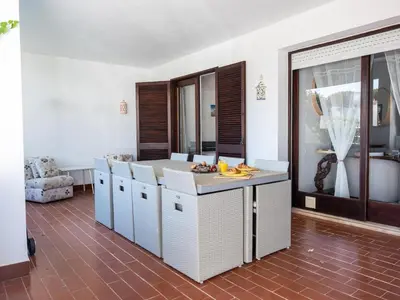 a kitchen with an island in the middle of a room at Balaia Praia Apartment by Stay ici Algarve Holiday Rental in Albufeira