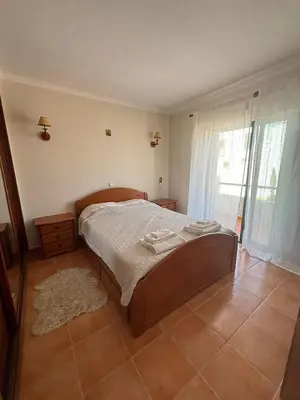 a bedroom with a bed with two towels on it at V3 Villa in Albufeira in Albufeira