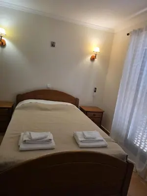 a bedroom with a bed with two towels on it at V3 Villa in Albufeira in Albufeira