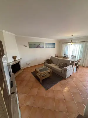 a living room with a couch and a table at V3 Villa in Albufeira in Albufeira
