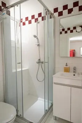 a bathroom with a shower and a sink at Moradia Mini Apartment in Faro