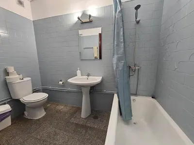 a bathroom with a sink and a toilet and a tub at Blife Tonya - private rooms at Santantonya 1st floor in Faro