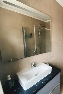 a bathroom with a white sink and a mirror at Country villa in Algarve, 15 min from beach in Albufeira