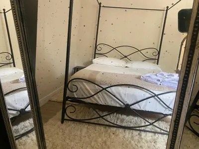 a mirror reflection of a bed in a room at Country villa in Algarve, 15 min from beach in Albufeira