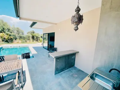 a kitchen with a sink and a swimming pool at Country villa in Algarve, 15 min from beach in Albufeira