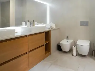 a bathroom with a sink and a toilet at Premium Apartment with Vilamoura Marina View in Vilamoura